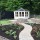 Summerhouse with new patio, repointed well, sett path and raised bed Added by Belinda Macdonald