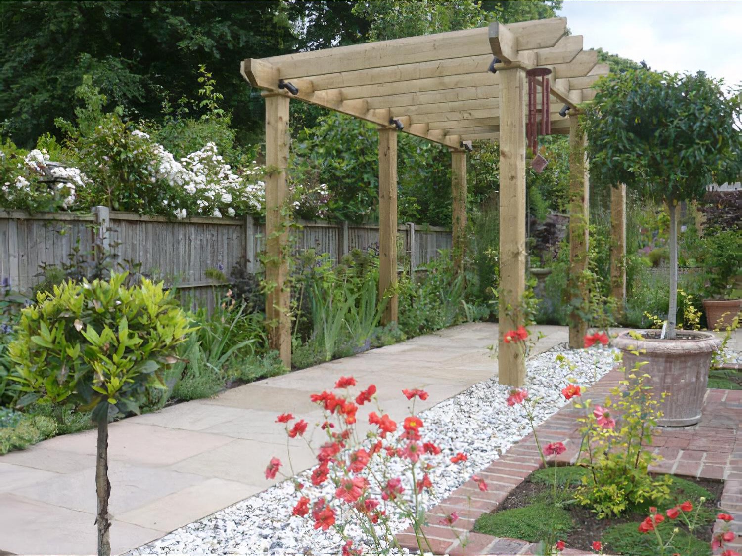 Sloping, long thin garden by garden designer Andrea Newill MSGD