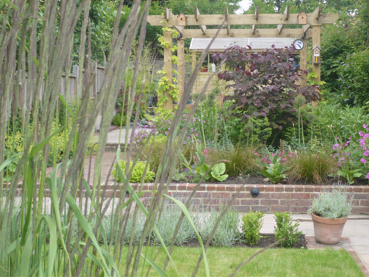 Sloping long garden by garden designer Andrea Newill