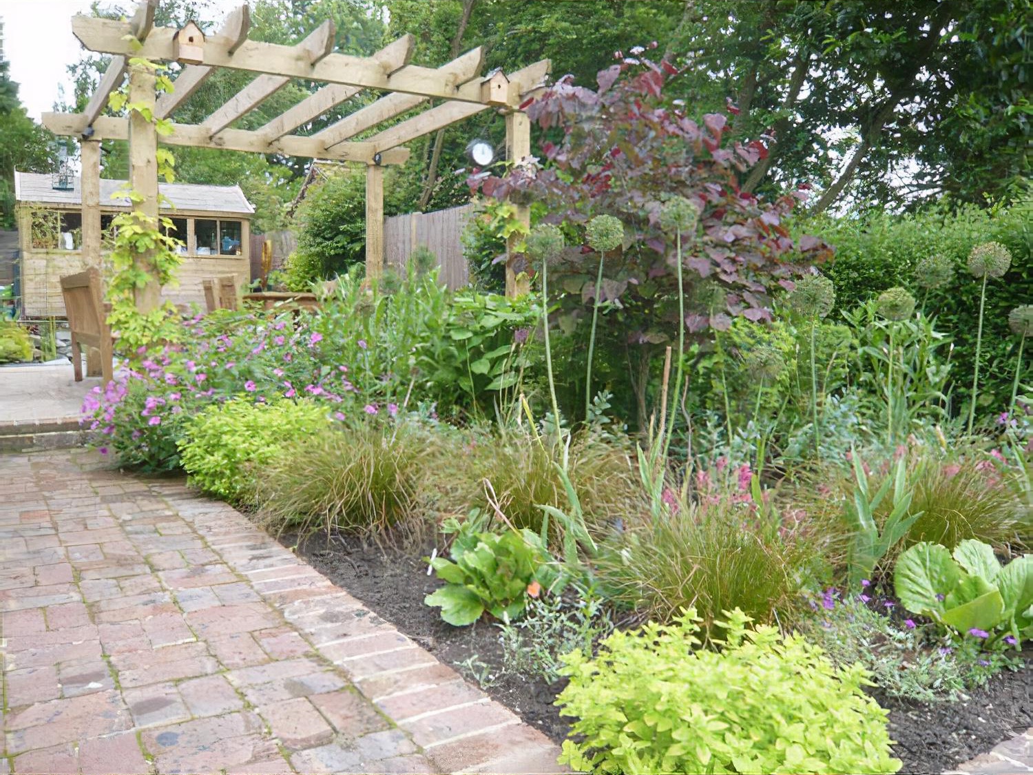 Sloping long garden by garden designer Andrea Newill