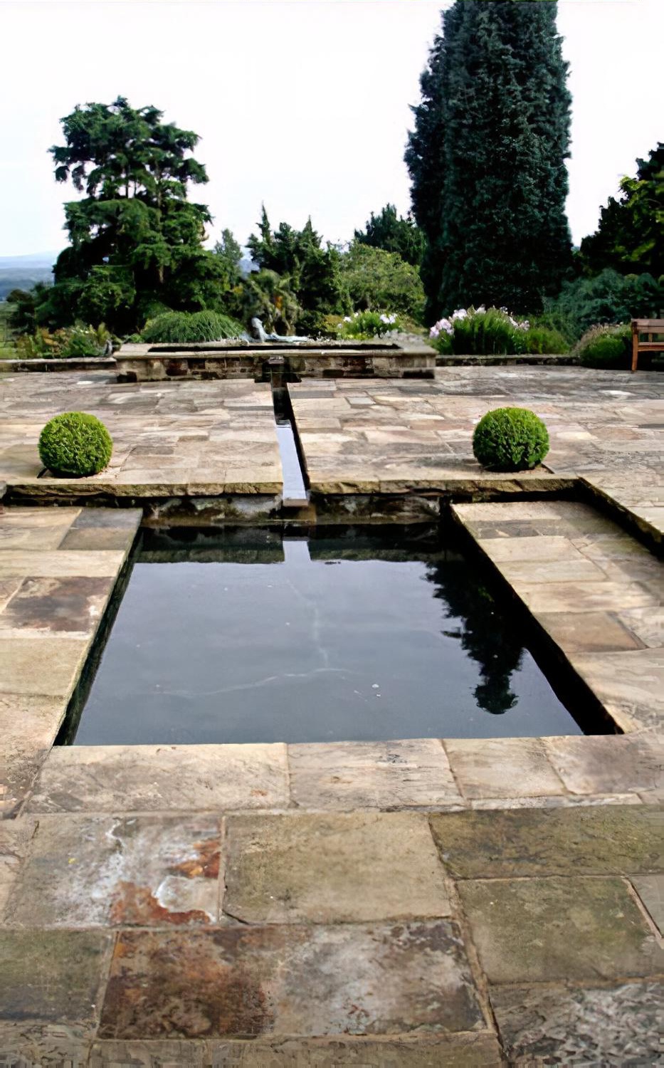 Water garden with reflective pool & rill by Hampshire garden designer Janet Bligh
