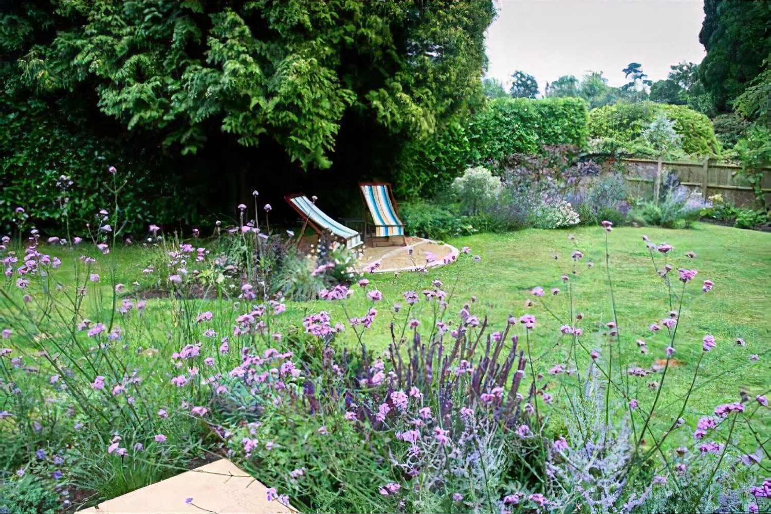 Town garden with raised pool, Haslemere, Surrey by Hampshire garden designer Janet Bligh